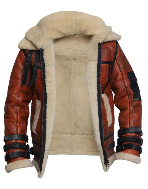 A brown leather aviator-style jacket with a thick cream-colored shearling lining, featuring black strap details on the sleeves and a large plush collar.