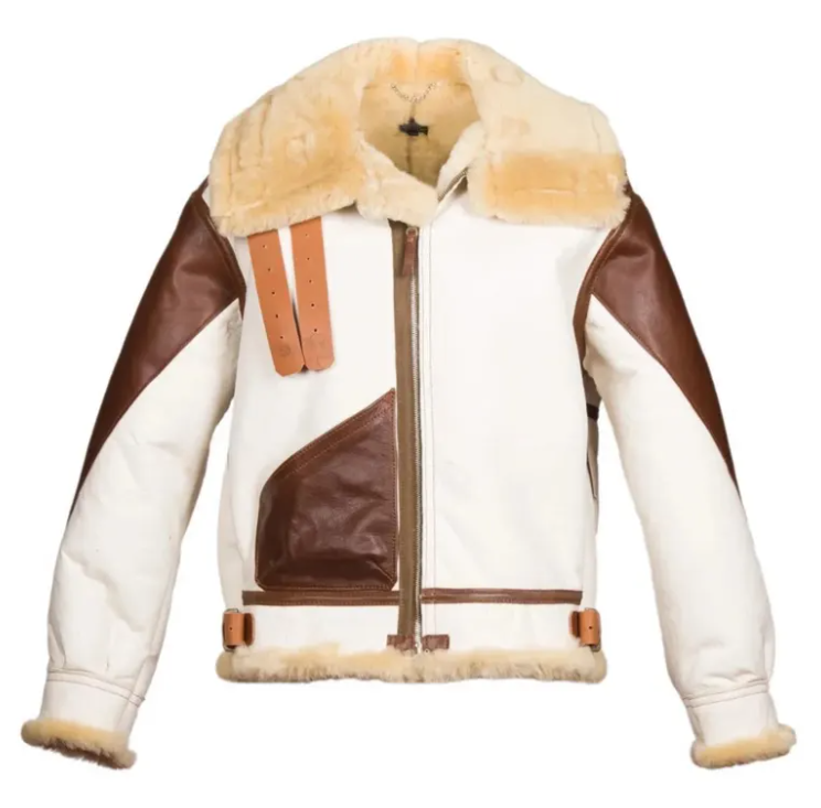 A colorblock aviator-style shearling jacket featuring cream-colored faux leather panels, dark brown leather panels, and a thick cream shearling collar and lining, shown against a plain white background.