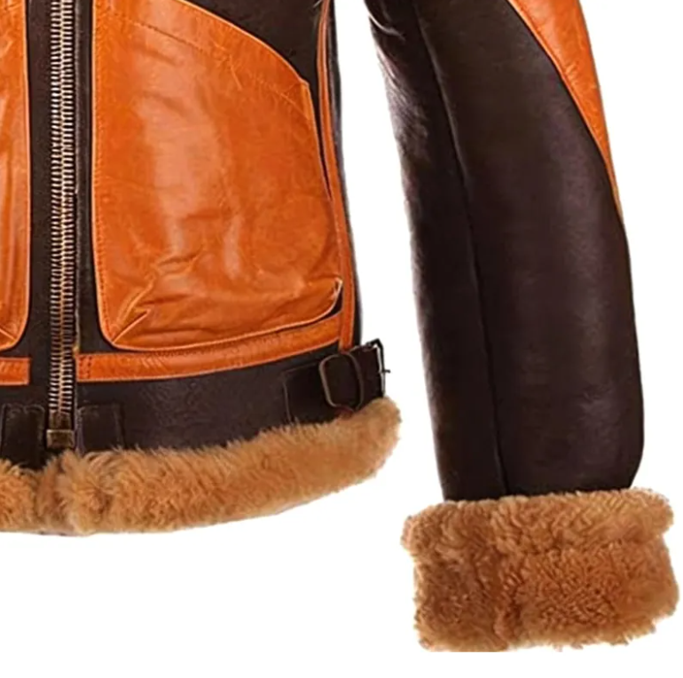 Close-up of a brown and tan leather jacket with a thick tan shearling lining, showing the side panel, front zipper, cuff, and lining detail on a white background.