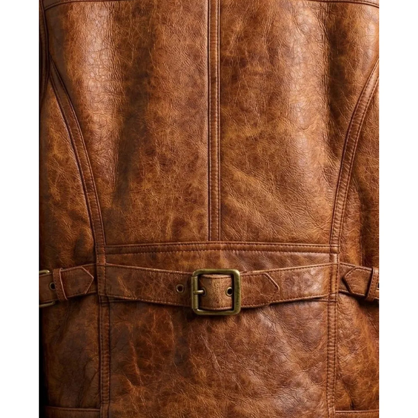 Close-up of a brown distressed leather jacket showing the back panel with a matching belt and brass buckle.