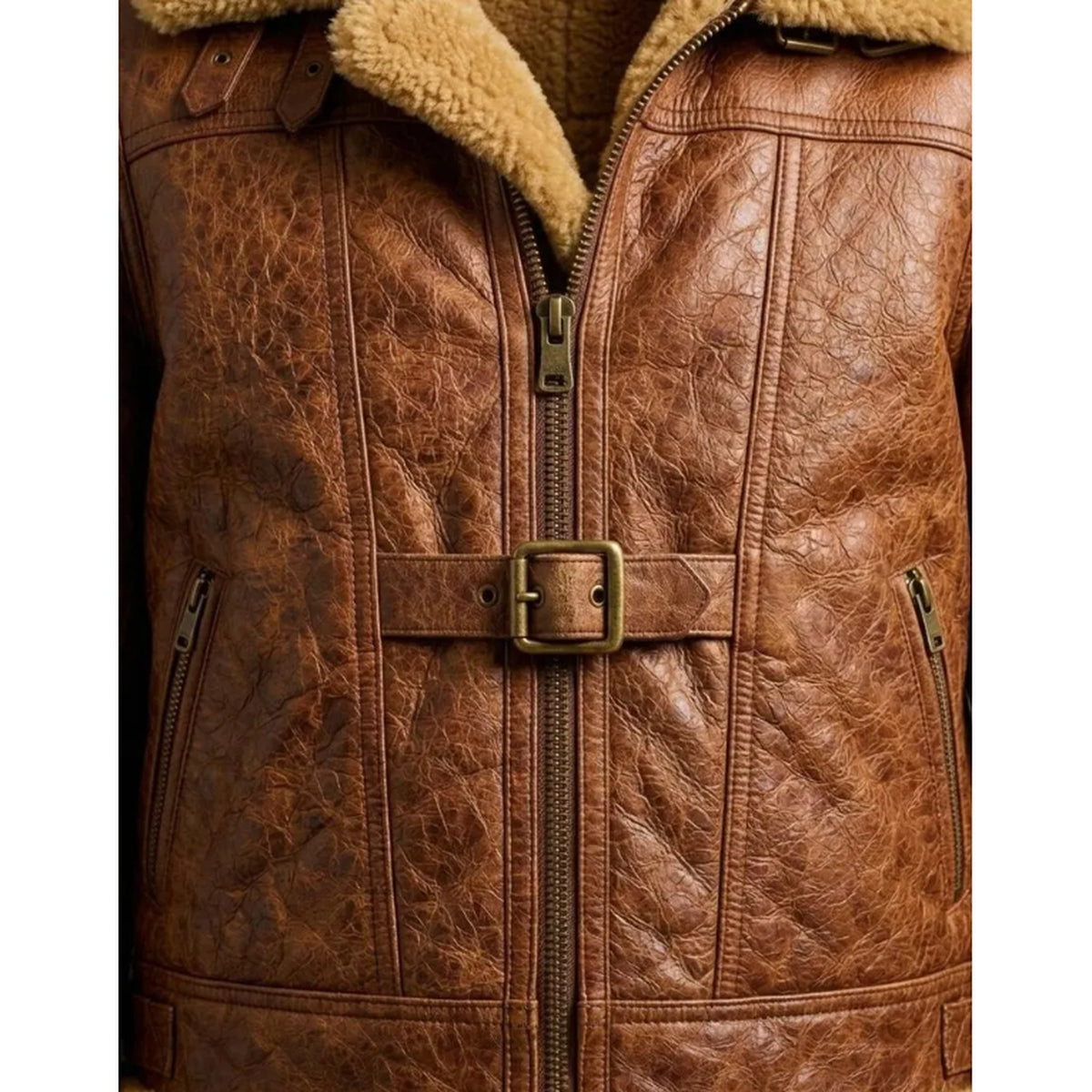 Close-up of a brown faux-leather aviator-style jacket with a tan sherpa collar, front zipper, and a matching brown belt with a square buckle.