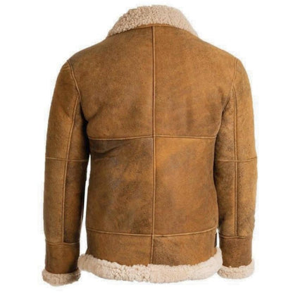 A brown suede shearling jacket shown from the back, featuring a warm tan-brown leather body and a contrasting cream-colored fleece lining at the collar, cuffs, and hem, set against a plain white background.