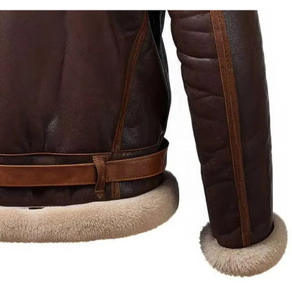 Close-up of a dark brown leather jacket showing the sleeve cuff with a thick beige shearling lining, the waist belt, and the back panel with matching lining.