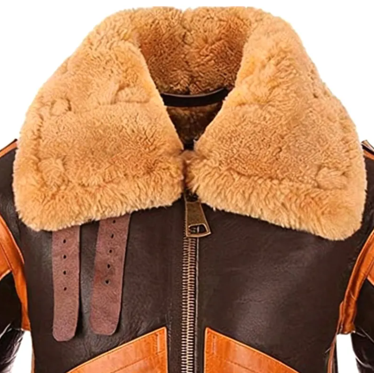 Close-up of a brown leather jacket with a large tan shearling-style collar and orange-brown trim details on a white background.