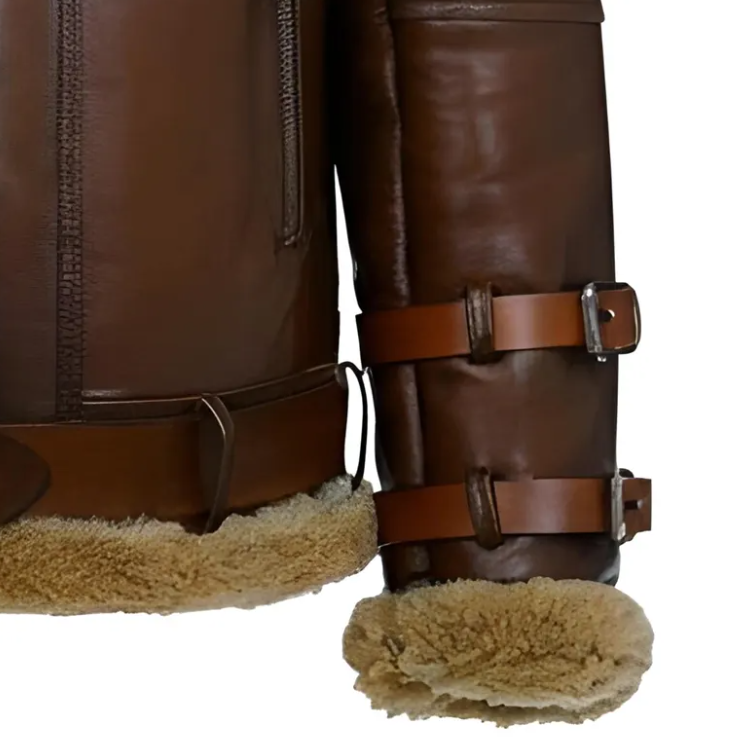 Close-up of brown leather aviator-style boots with tan shearling lining and adjustable leather straps with metal buckles, shown on a white background.