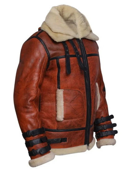 A brown leather aviator jacket with a cream-colored shearling lining, featuring black trim, front buckle straps, and a high collar, shown against a plain white background.
