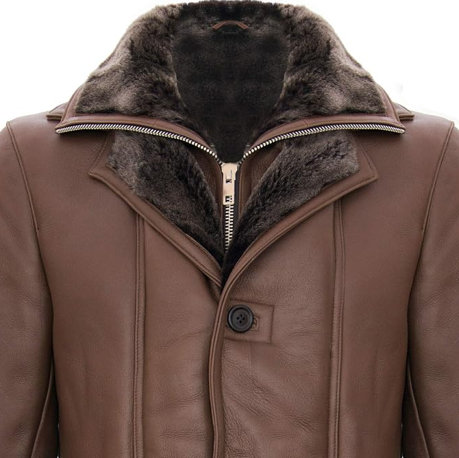 A close-up of a men's brown leather jacket featuring a plush, dark brown faux-fur collar and a front zipper closure.